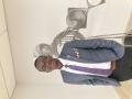 Collins in a Suit before the Intern Closing Ceremony